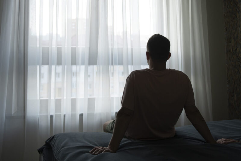 portrait adult man with curtains shadow from window scaled 1