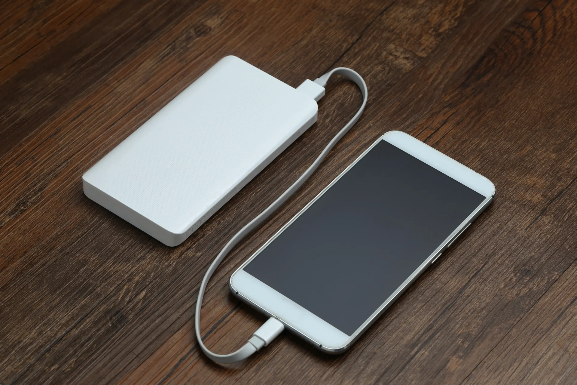powerbank cellphone wooden table