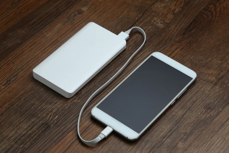 powerbank cellphone wooden table